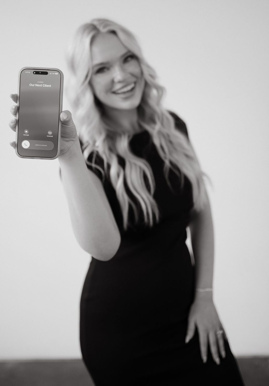 Riley holding a phone